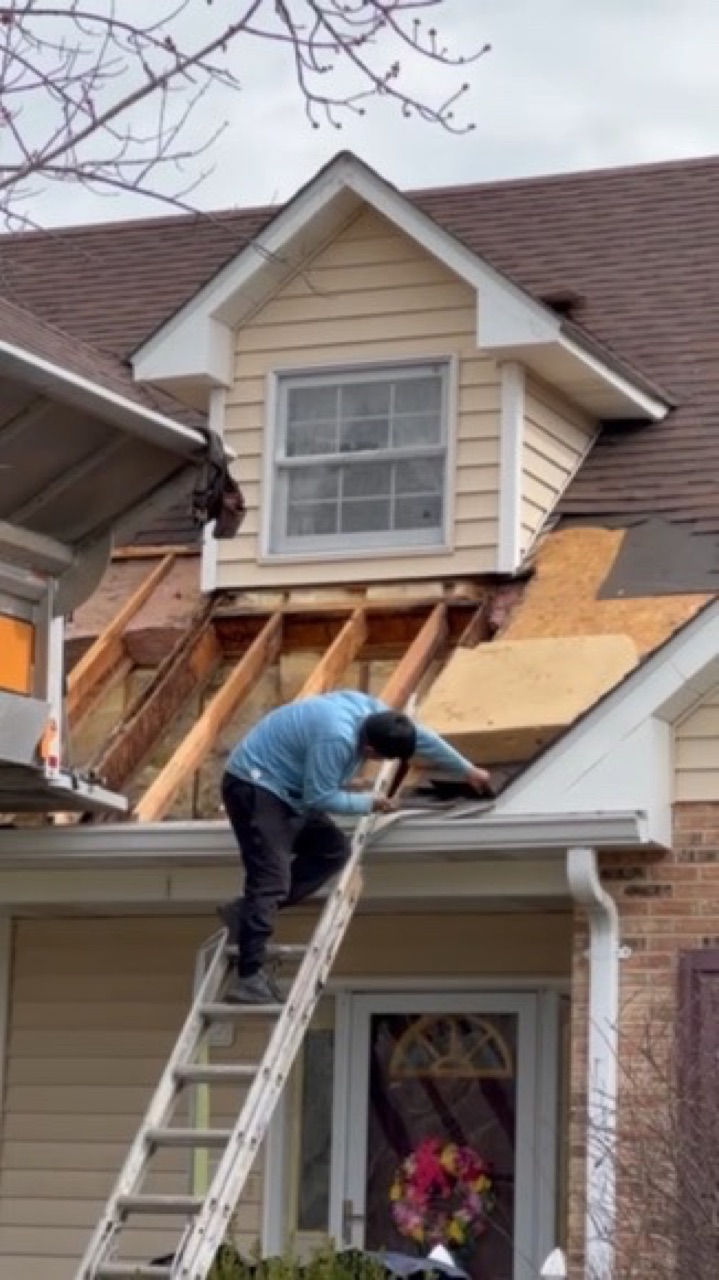 Emmendorfer crew detailing a roofline and gutters